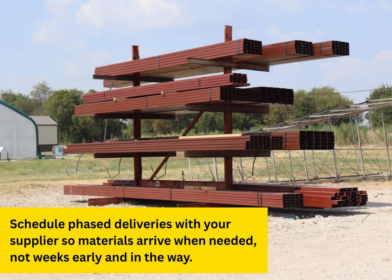 Stacked steel beams and metal building materials stored outdoors for construction use