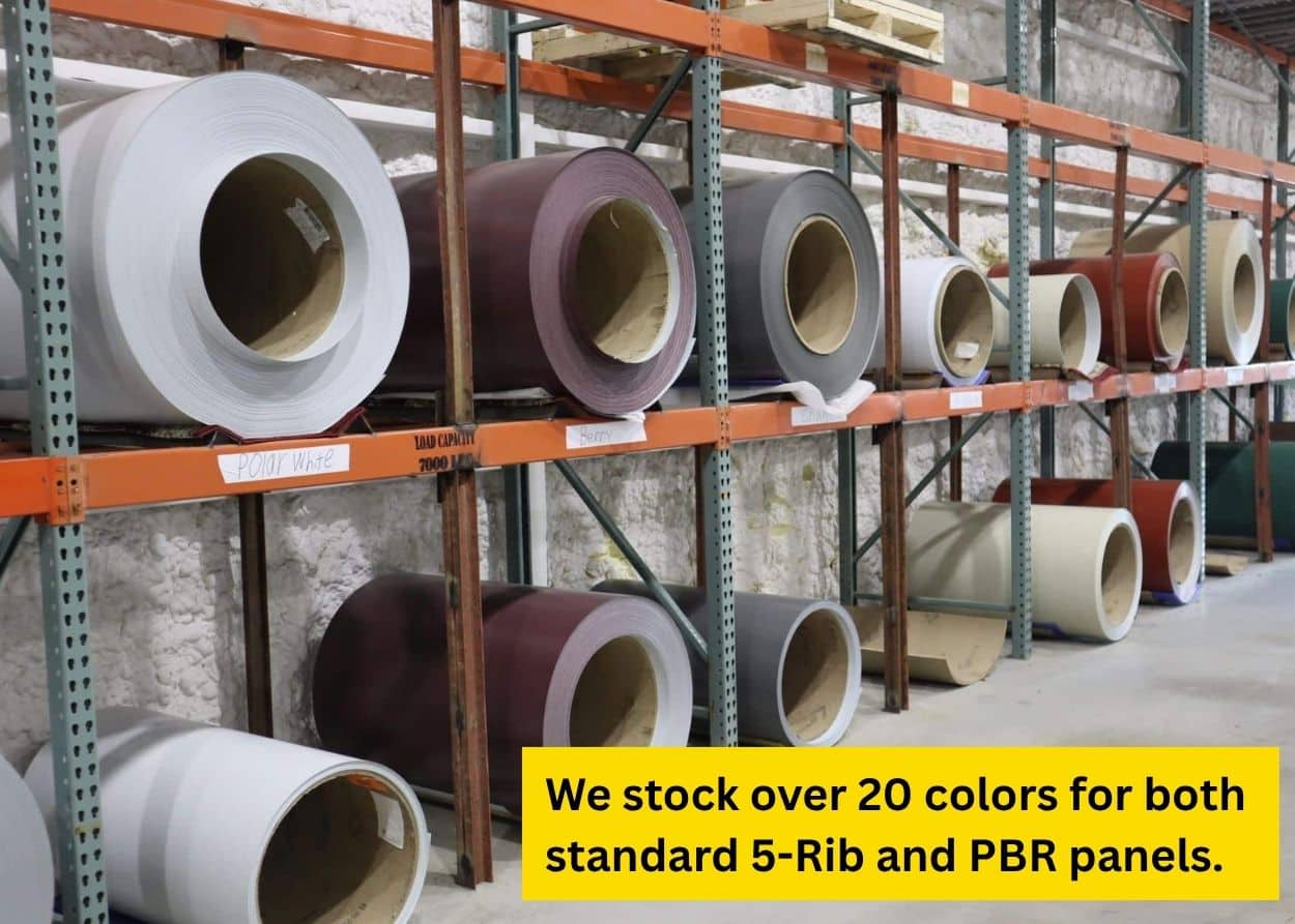 Metal roofing and siding coils in multiple colors stored on warehouse racks at Fairlie Metal House